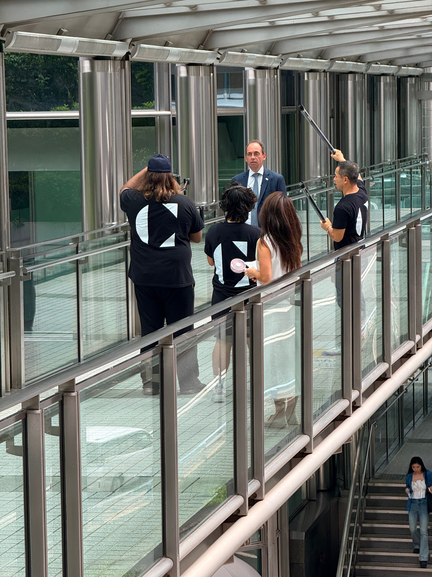 Jamie on location in Hong Kong interviewing an executive with the video production crew he interned with.